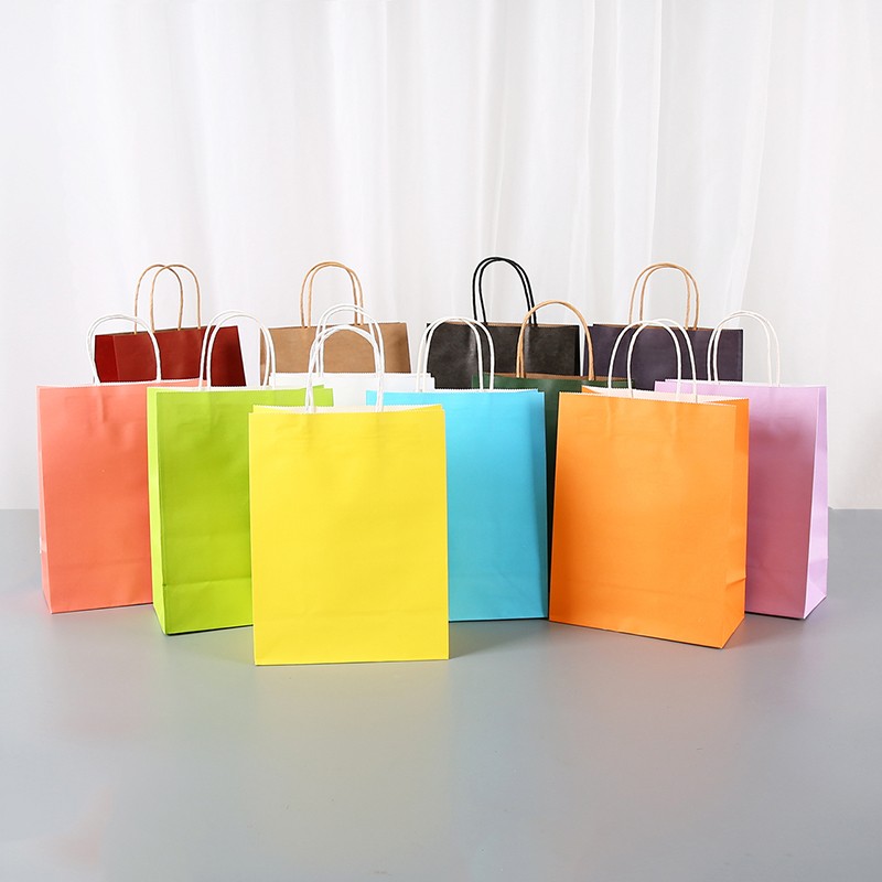 Holiday jewelry package in raw wood pulp kraft paper bag vertical white cow style